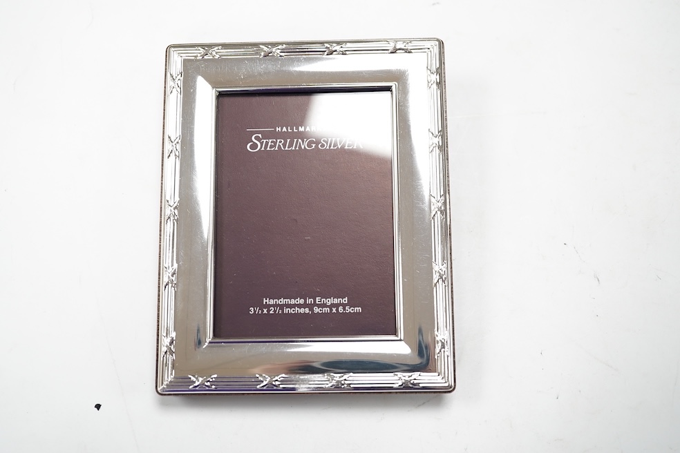 Six assorted modern Carr's of Sheffield silver mounted photograph frames, largest 12.9cm, three silver plated frames and three Italian sterling mounted frames. Condition - good